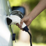 White Electric Vehicle (EV) & White EV charger plug